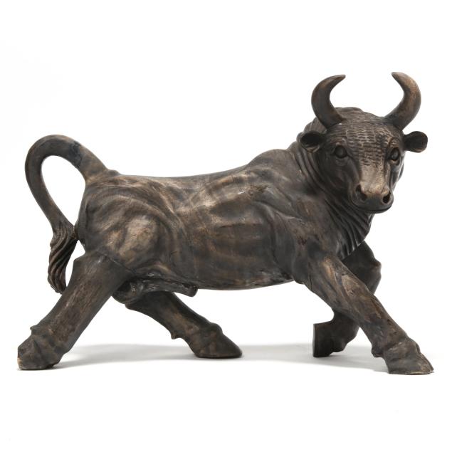 large-stained-wooden-carving-of-a-bull