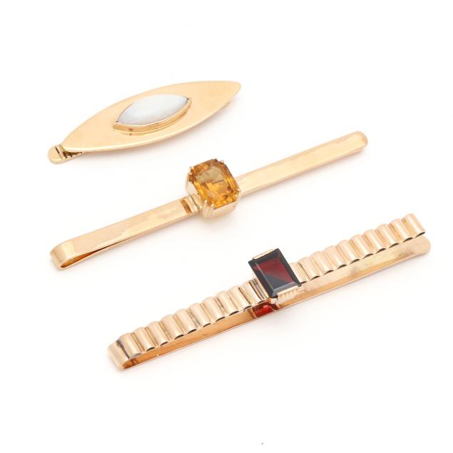 three-gold-and-gem-set-tie-bars