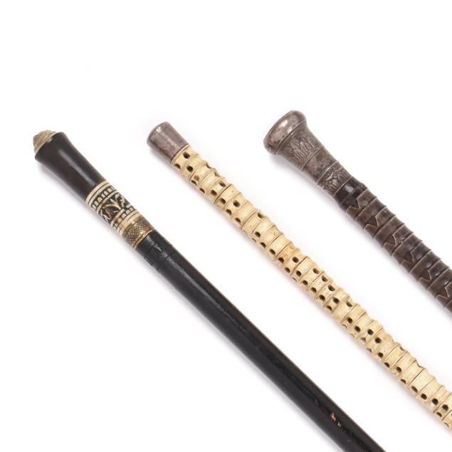 three-silver-mounted-walking-sticks-including-sword-form