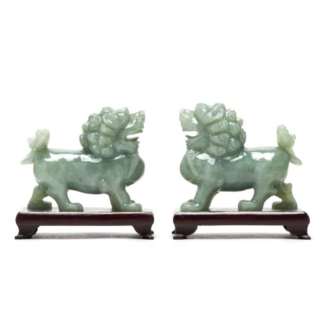a-pair-of-carved-celadon-green-hardstone-foo-lions
