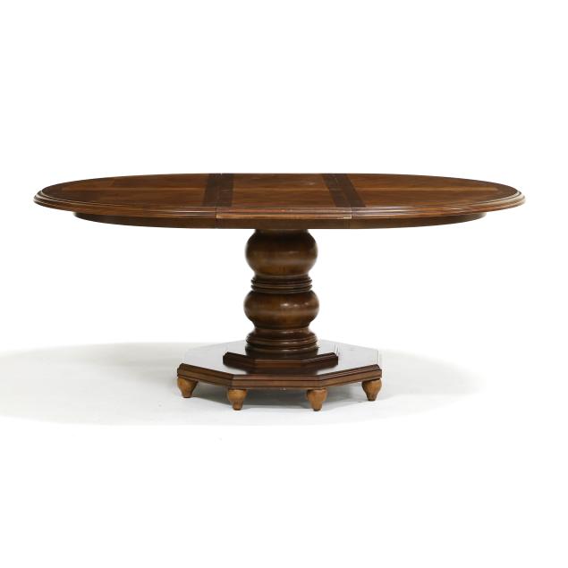 universal-circular-oak-pedestal-table-with-leaf