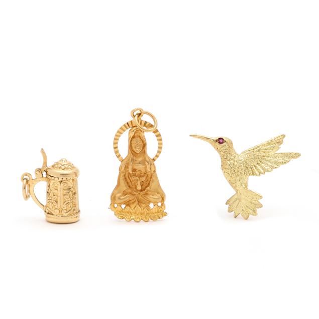 two-gold-charms-and-a-gold-brooch