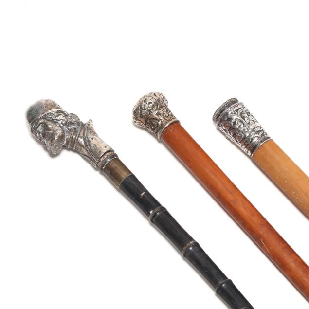 three-antique-silver-mounted-walking-sticks