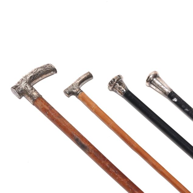 collection-of-four-silver-and-sterling-mounted-walking-sticks