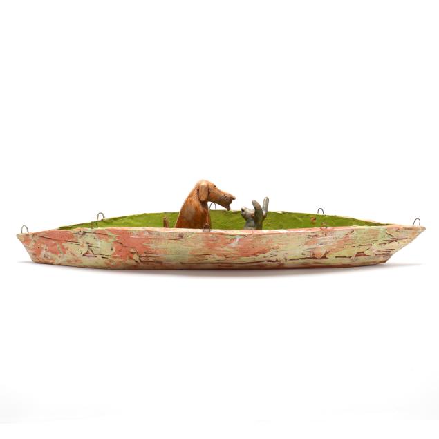 whimsical-handmade-ceramic-sculpture-with-dog-and-bunny