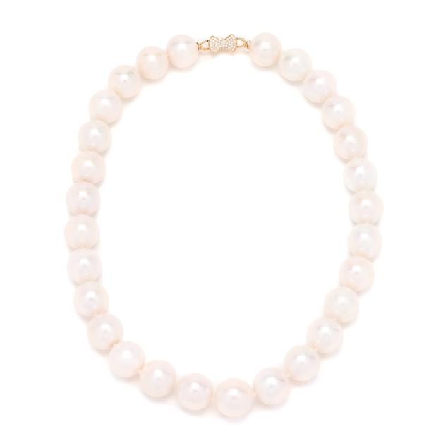 single-strand-south-sea-pearl-necklace-with-gold-and-diamond-set-bow-clasp