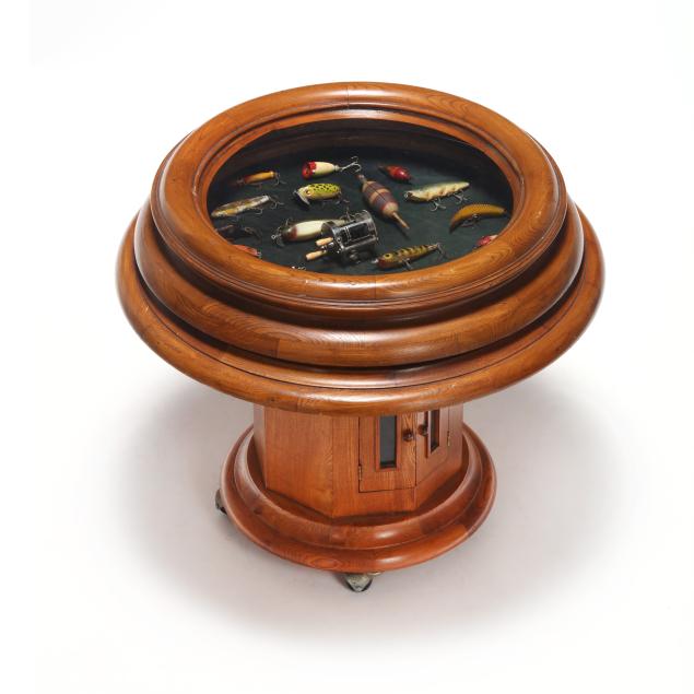 vintage-porthole-window-side-table-with-fishing-accoutrements