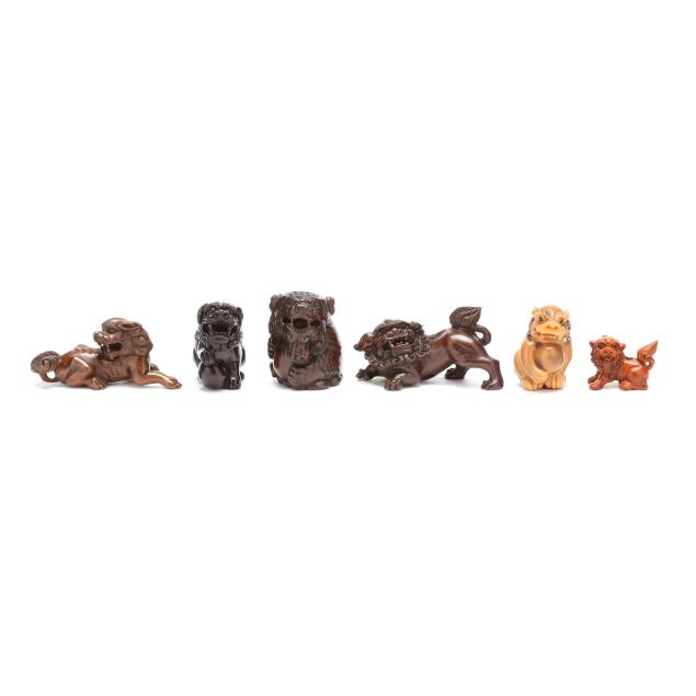 a-group-of-six-japanese-carved-foo-dog-netsukes