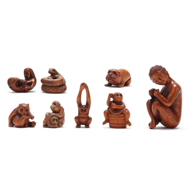 a-group-of-eight-japanese-carved-wood-netsukes