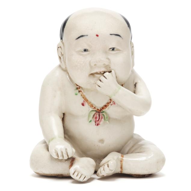 a-chinese-porcelain-figure-of-a-boy