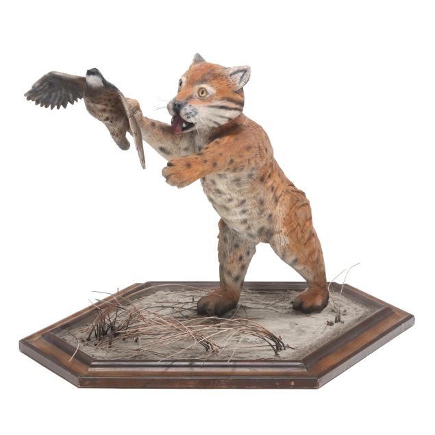 carved-bobcat-chasing-quail