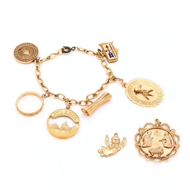 gold-charm-bracelet-with-eight-gold-and-gold-filled-charms