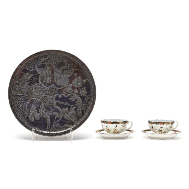 a-pair-of-japanese-porcelain-teacups-with-saucers-and-a-mixed-metal-plaque