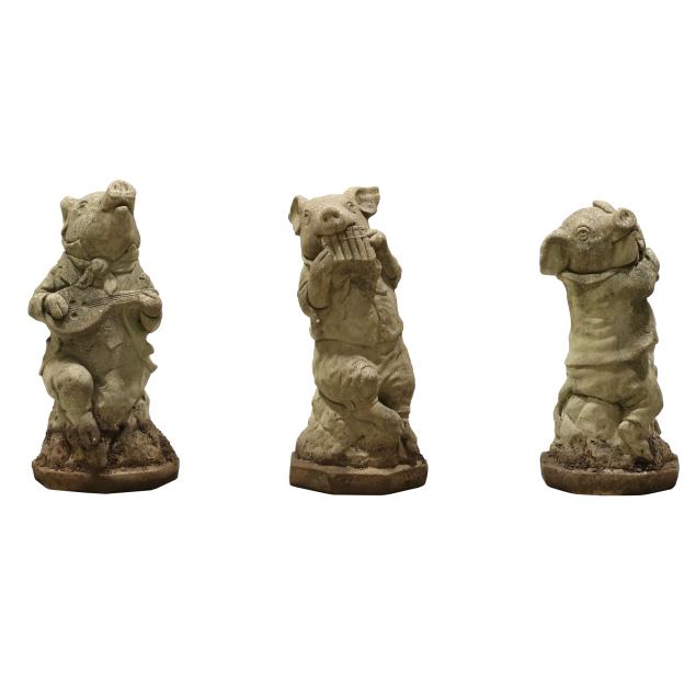 three-cast-stone-pigs-playing-instruments