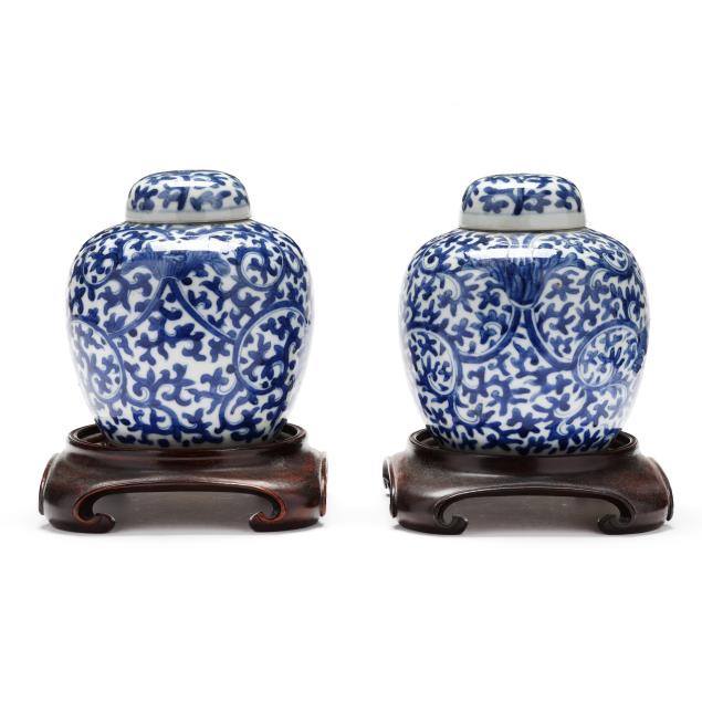 a-pair-of-chinese-blue-and-white-lidded-ginger-jars-with-stands