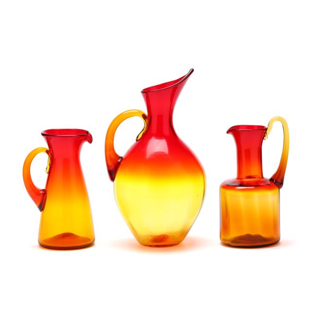 three-blenko-amberina-glass-pitchers