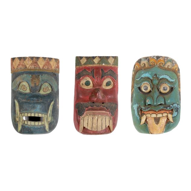 three-southeast-asian-carved-wooden-masks