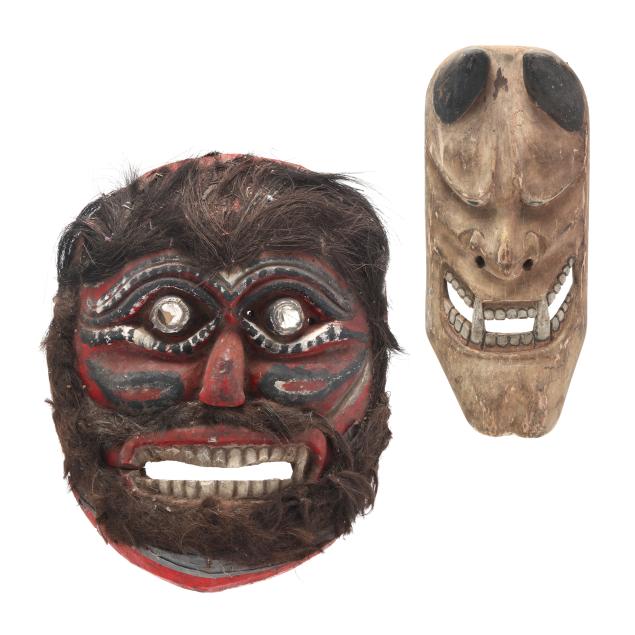 two-carved-southeast-asian-wooden-masks