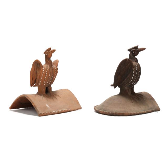 two-large-terracotta-roof-tiles-in-the-form-of-crested-birds