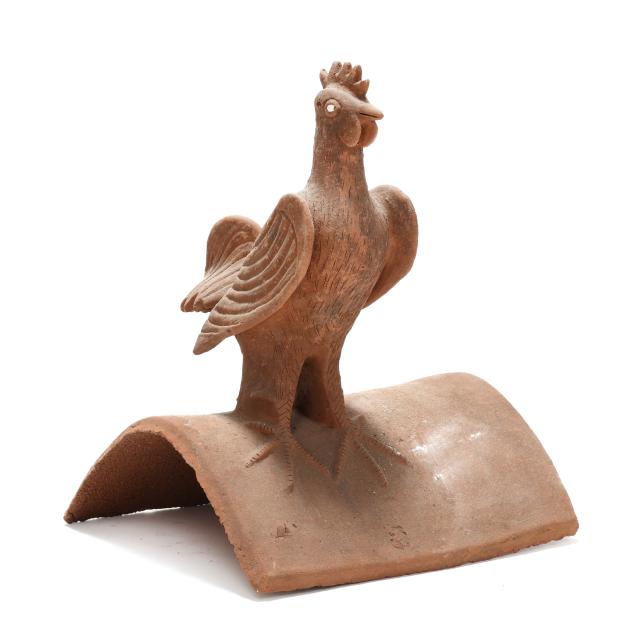 terracotta-roof-tile-surmounted-by-a-rooster