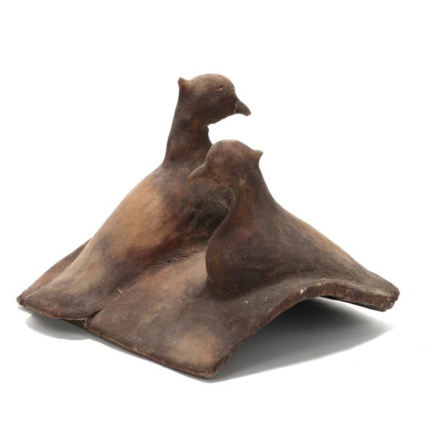 terracotta-roof-tile-with-two-resting-birds