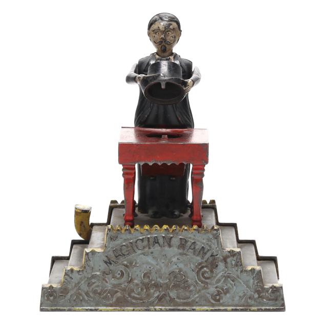 j-e-stevens-co-magician-mechanical-coin-bank