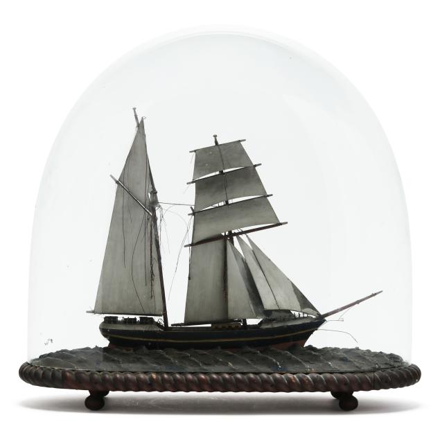 a-model-ship-under-cloche