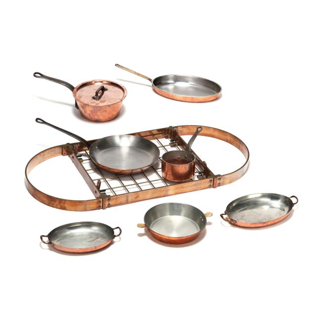 assorted-copper-cookware-and-ceiling-pot-rack