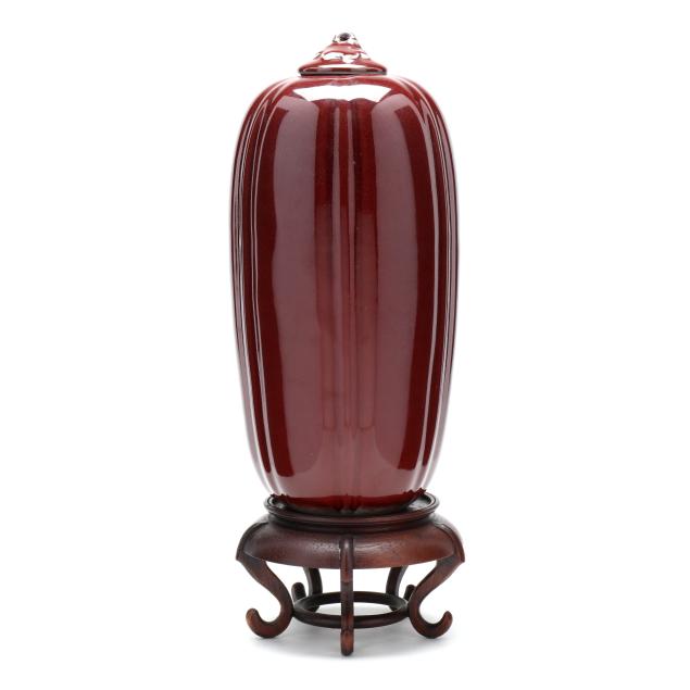 a-tall-porcelain-gourd-form-sang-de-boeuf-vase-with-cover