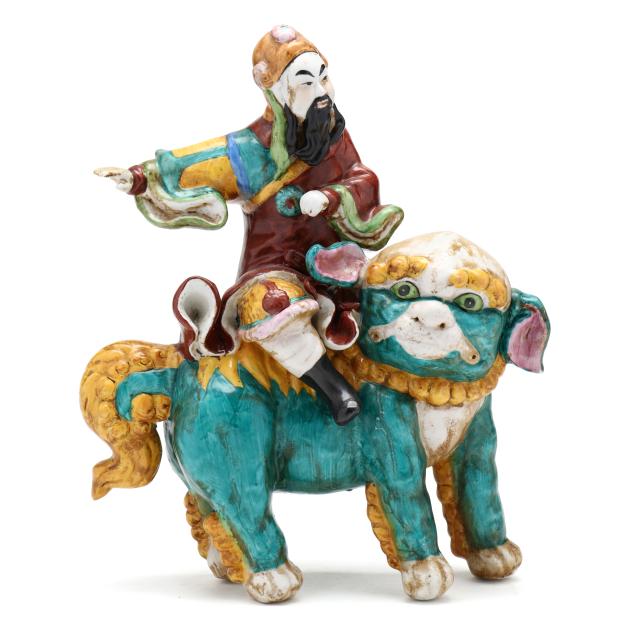 a-chinese-porcelain-tang-style-figure-astride-a-foo-lion