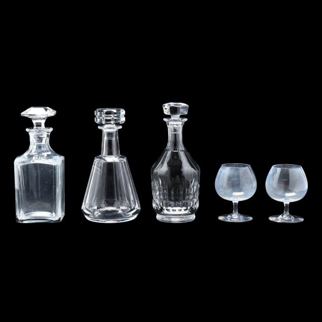 three-baccarat-crystal-decanters-and-a-pair-of-brandy-snifters