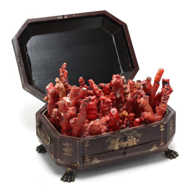 a-collection-of-branch-coral-in-an-antique-chinese-lacquered-and-gilt-box