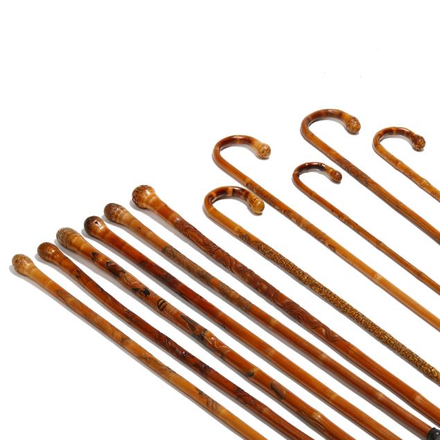 a-collection-of-11-hand-carved-japanese-walking-canes-with-inscriptions
