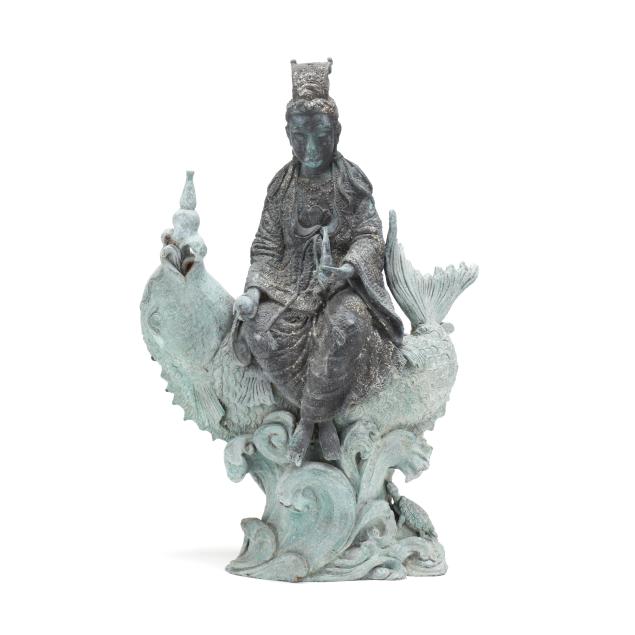a-bronze-sculpture-of-guanyin-seated-on-a-fish