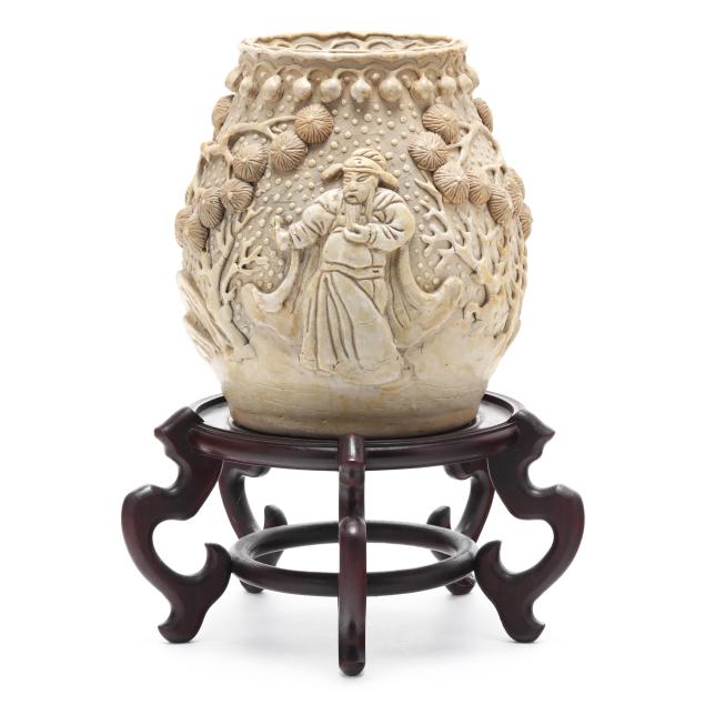 a-chinese-relief-molded-pottery-vase-with-stand