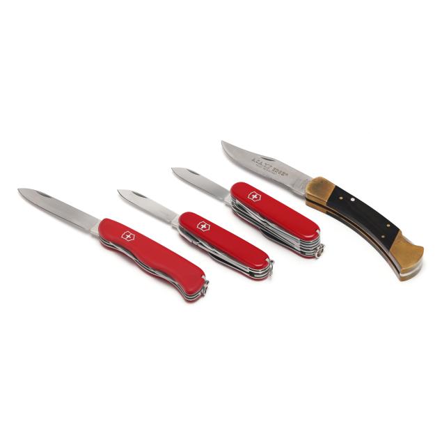 four-outdoorsman-pocket-knives-and-assorted-accessories