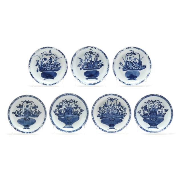 a-group-of-seven-chinese-kangxi-blue-and-white-porcelain-plates-with-flower-baskets