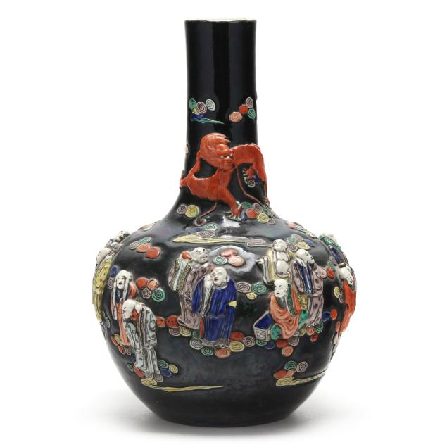 a-chinese-famille-noir-relief-decorated-vase-with-the-eight-immortals