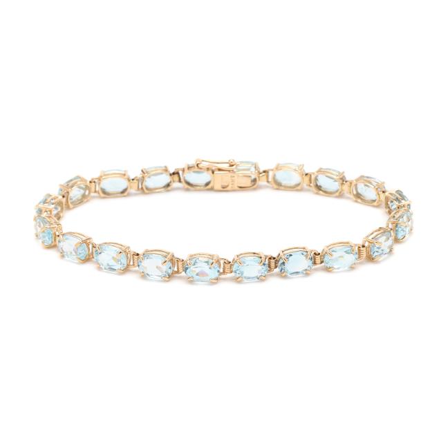 gold-and-blue-topaz-line-bracelet