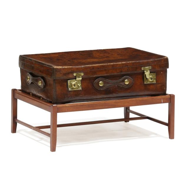 antique-leather-trunk-on-stand