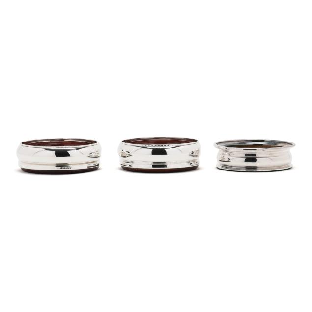 pair-of-elizabeth-ii-silver-wine-coasters-and-a-silver-plated-wine-coaster