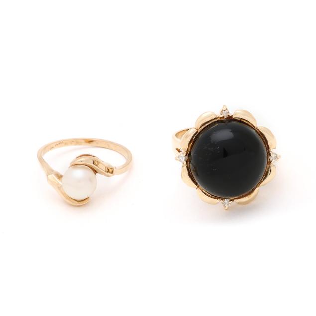 two-gold-and-gem-set-rings