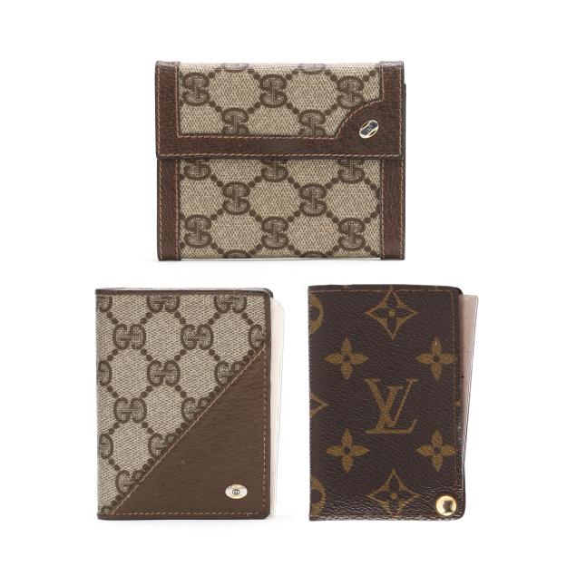 a-group-of-three-designer-wallets