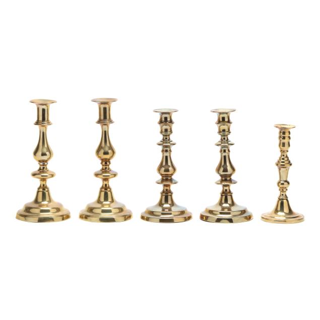 collection-of-five-antique-brass-push-up-candlesticks
