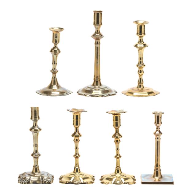 seven-english-18th-century-brass-candlesticks-including-shell-base