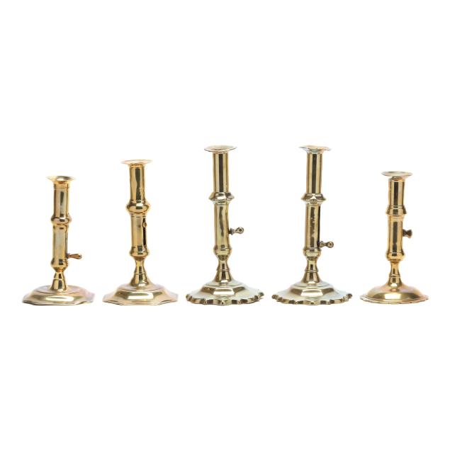 five-english-18th-century-brass-push-up-candlesticks