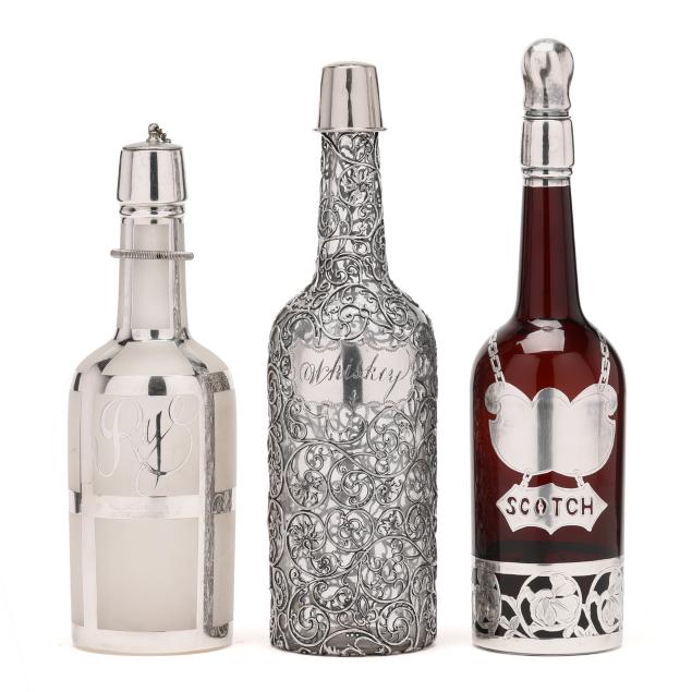 three-silver-overlaid-glass-decanter-bottles