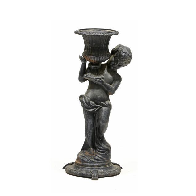 a-vintage-cast-iron-figural-planter