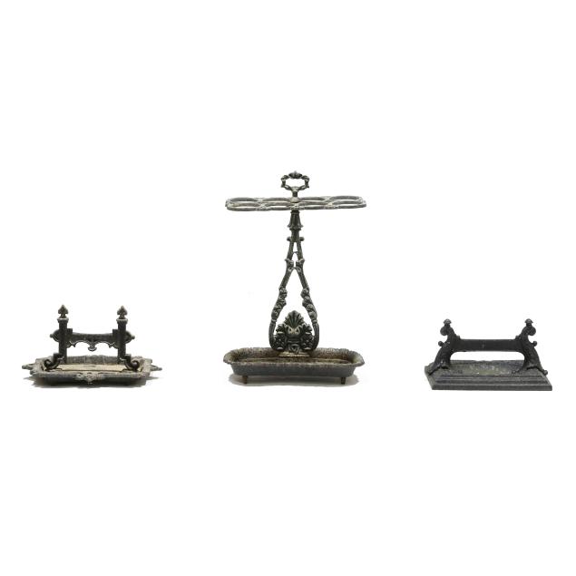 two-cast-iron-boot-scrapes-and-an-umbrella-stand