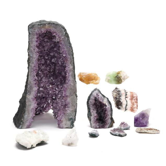 a-large-section-of-an-amethyst-geode-with-a-host-of-smaller-minerals